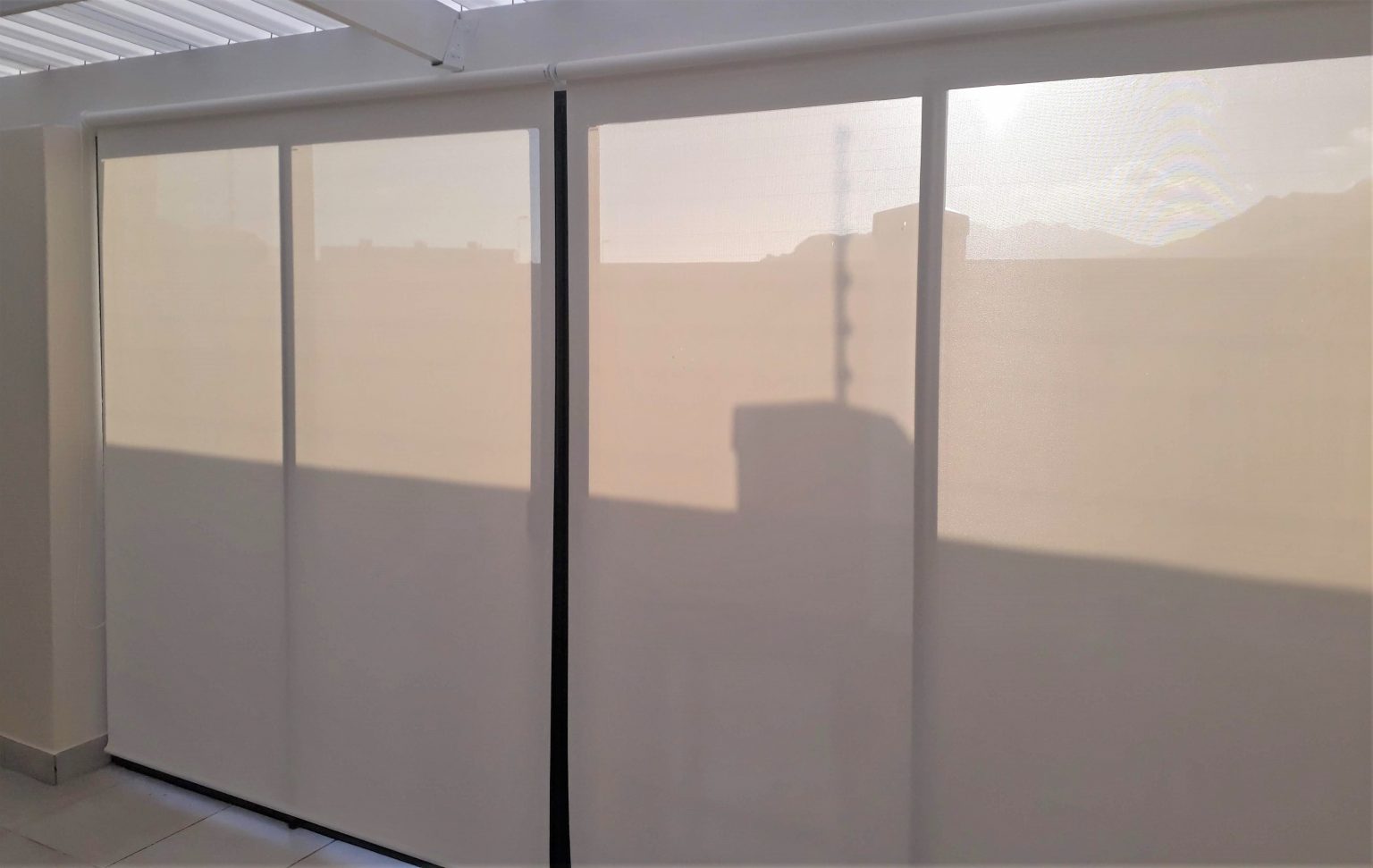Sunscreen roller blinds are designed to manage heat and glare.
